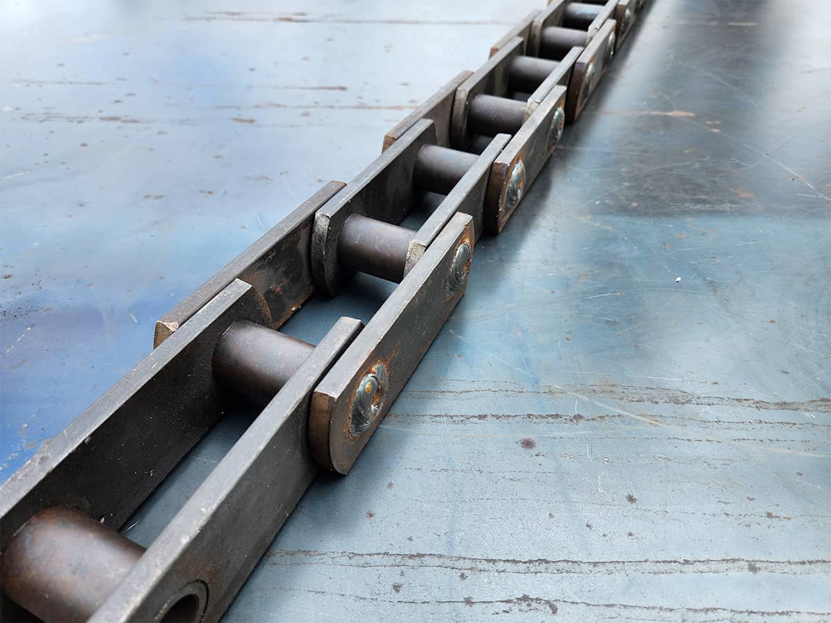 cadena transportadora de troncos de alta resistencia de cadenas metalplas utilizada en la industria maderera para transporte de madera pesada